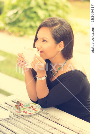 Coffee. Beautiful Girl Drinking Tea or Coffee in Cafe. Beauty Mo Coffee. Beautiful Girl Drinking Tea or Coffee in Cafe. Beauty Mo 16309417