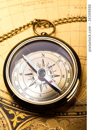 Compass on the old paper background Compass on the old paper background 16309986