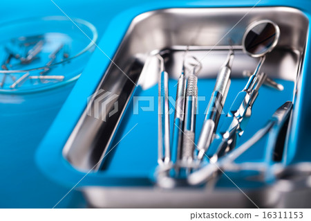 Dentist equipment on blue background Dentist equipment on blue background 16311153