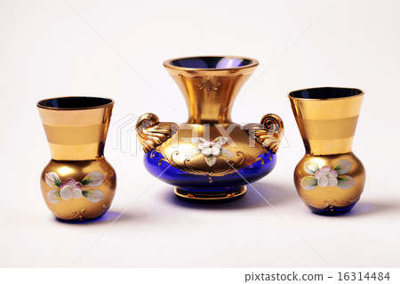 empty blue and gold glass vase and small wineglass 16314484