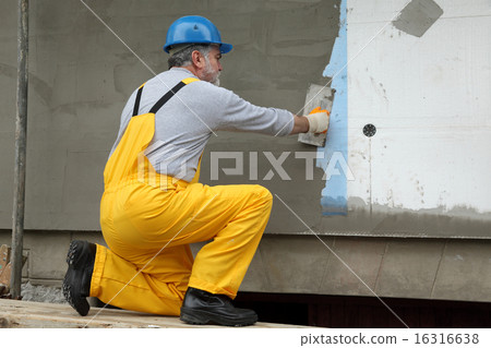Wall insulation, spreading mortar over mesh and styrofoam Wall insulation, spreading mortar over mesh and styrofoam 16316638
