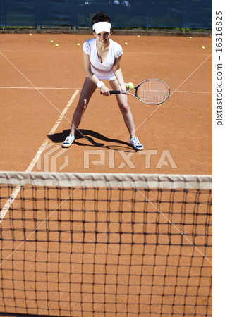 Girl playing tennis on the court 16316825