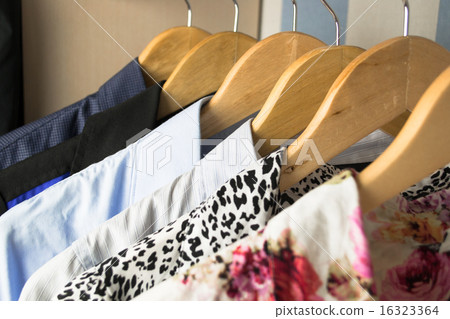 Different clothes on hangers close up Different clothes on hangers close up 16323364