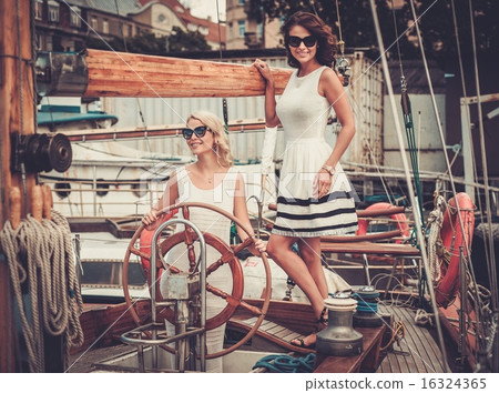 Stylish wealthy women on a luxury yacht Stylish wealthy women on a luxury yacht 16324365