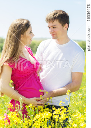 Pregnant girl with husband on the nature Pregnant girl with husband on the nature 16336478