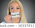 Woman holding card with Thank you word 16337411