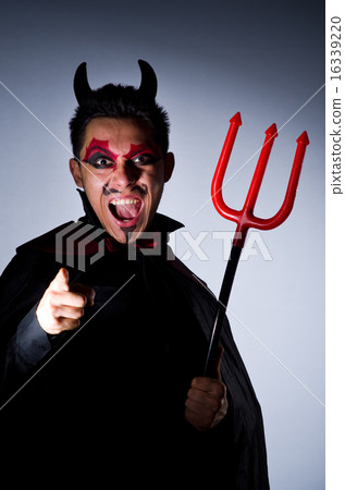 Man in devil costume in halloween concept Man in devil costume in halloween concept 16339220