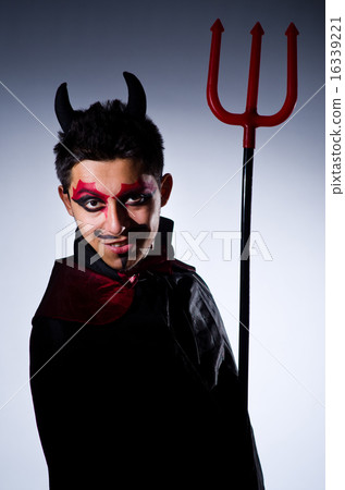 Man in devil costume in halloween concept Man in devil costume in halloween concept 16339221