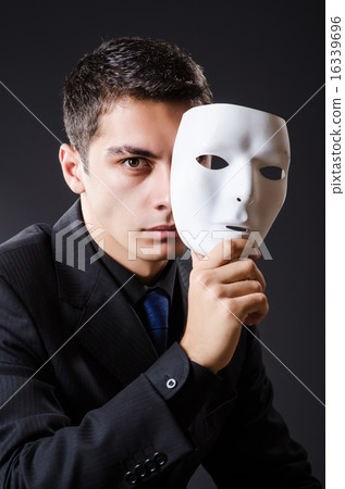 Man with mask in the dark Man with mask in the dark 16339696