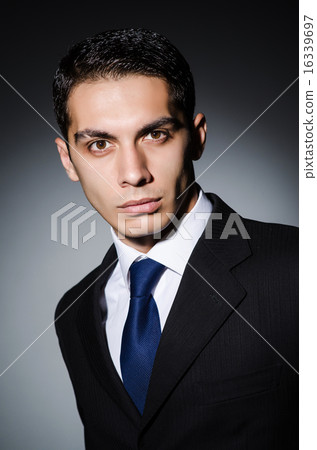 Portrait of man in dark studio Portrait of man in dark studio 16339697