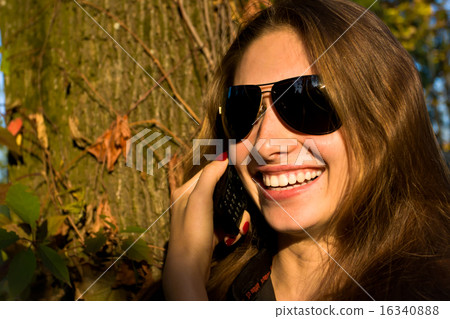 Beautiful girl says on the mobile Beautiful girl says on the mobile 16340888