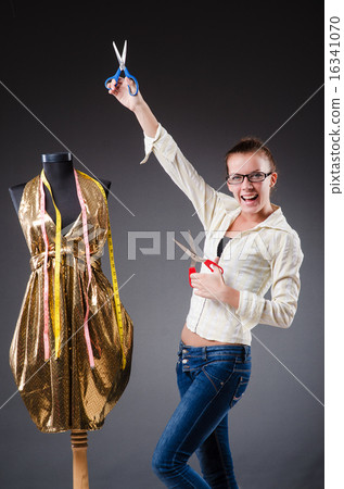 Woman tailor working on clothing 16341070