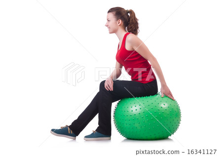 Young woman with ball exercising on white Young woman with ball exercising on white 16341127