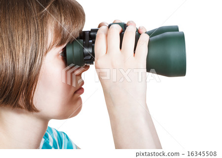 side view of girl looks through binoculars 16345508