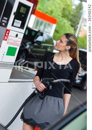 woman in petrol station 16348142
