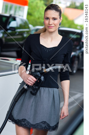 woman in petrol station woman in petrol station 16348143