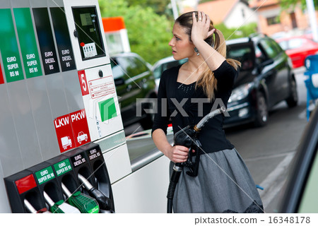 woman in gas station woman in gas station 16348178