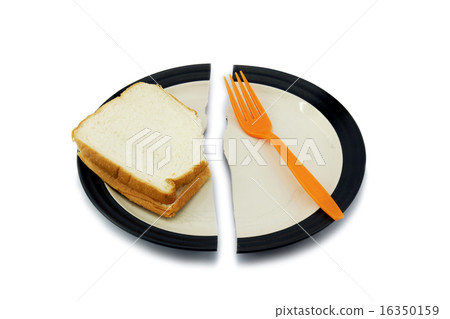 Sandwich bread and a fork on a broken plate 16350159