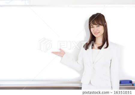 A woman pointing at the white board 16351031