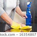 Woman cleaning kitchen 16354807