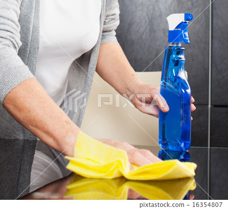 Woman cleaning kitchen Woman cleaning kitchen 16354807