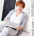 Mature woman with laptop 16354812