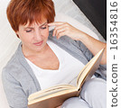 Adult woman reading book 16354816