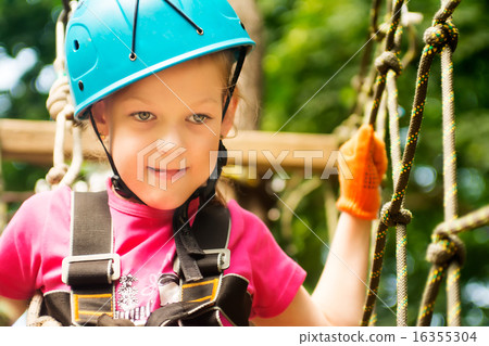 Five year boy on rope-way in forest 16355304