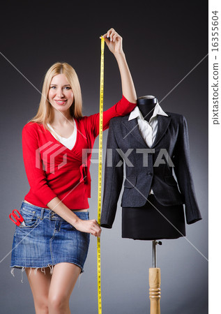 Woman tailor working on clothing 16355604