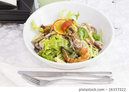 seafood salad on a plate on a white background 16357822
