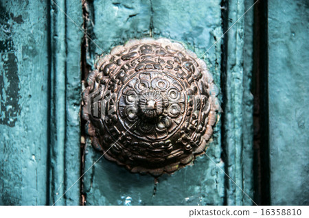 Copper door decoration on the old door in Cuzco, 16358810