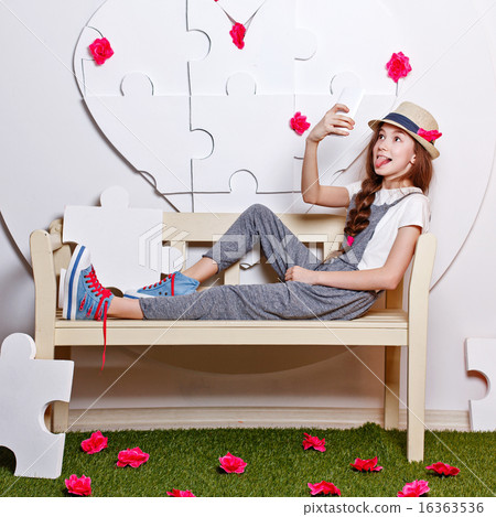 Trendy teenage girl with a cell phone. Selfie 16363536