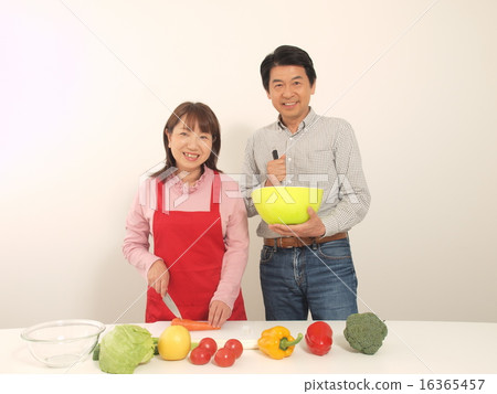 Senior couple cooking with a smile Senior couple cooking with a smile 16365457
