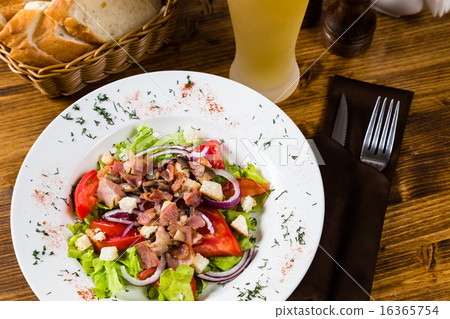 meat salad with spices and vegetables with beer 16365754