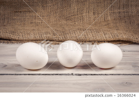 Three eggs on a wooden table Three eggs on a wooden table 16366024
