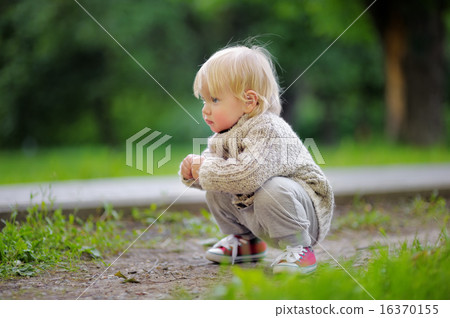 Toddler playing at the park 16370155