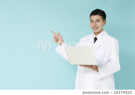 Male with white coat pointing with notebook PC Male with white coat pointing with notebook PC 16374920