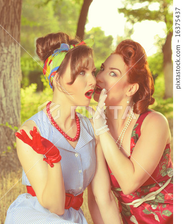 two girls gossiping two girls gossiping 16375437
