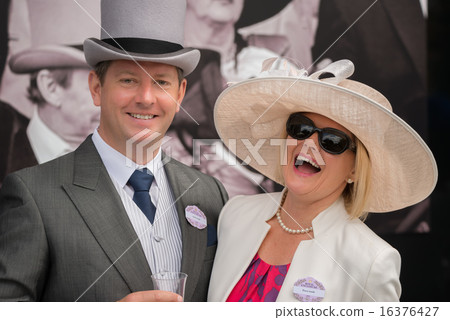 Couple at Royal Ascot laughing at camera Couple at Royal Ascot laughing at camera 16376427