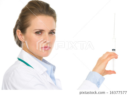 Serious medical doctor woman holding syringe Serious medical doctor woman holding syringe 16377577