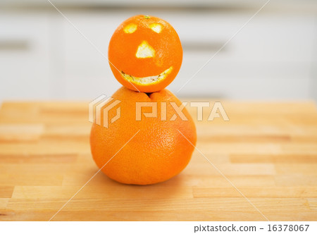 Closeup on orange with funny face 16378067