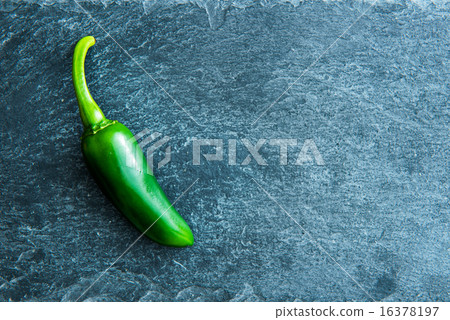 Closeup on green chili pepper on stone substrate Closeup on green chili pepper on stone substrate 16378197