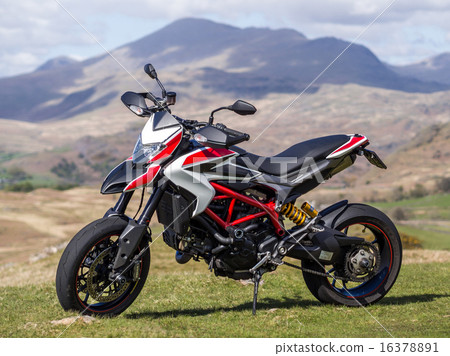 Motard type large motorcycle motorcycle with the mountains in the Lake District in the background 16378891