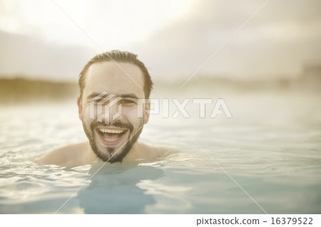 Portrait of smiling young man in the pool Portrait of smiling young man in the pool 16379522
