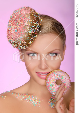 charming woman with creative hairstyle from donut charming woman with creative hairstyle from donut 16382289