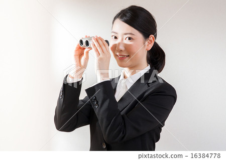 A woman with binoculars 16384778