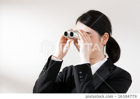 A woman with binoculars 16384779