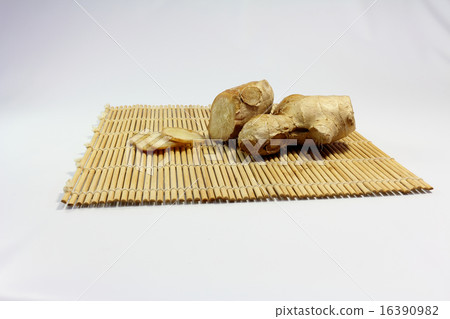 Ginger: Block and slice of ginger on bamboo sushi roll 16390982