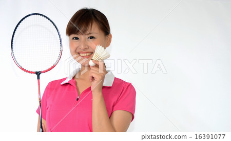 A young lady playing badminton 16391077