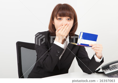 A woman watching a passbook A woman watching a passbook 16397063